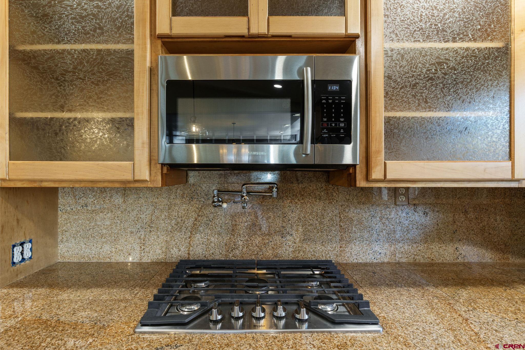 486 South Church Street Bayfield, CO 81122 - Photo 5 of 32 a kitchen with a stove and a microwave