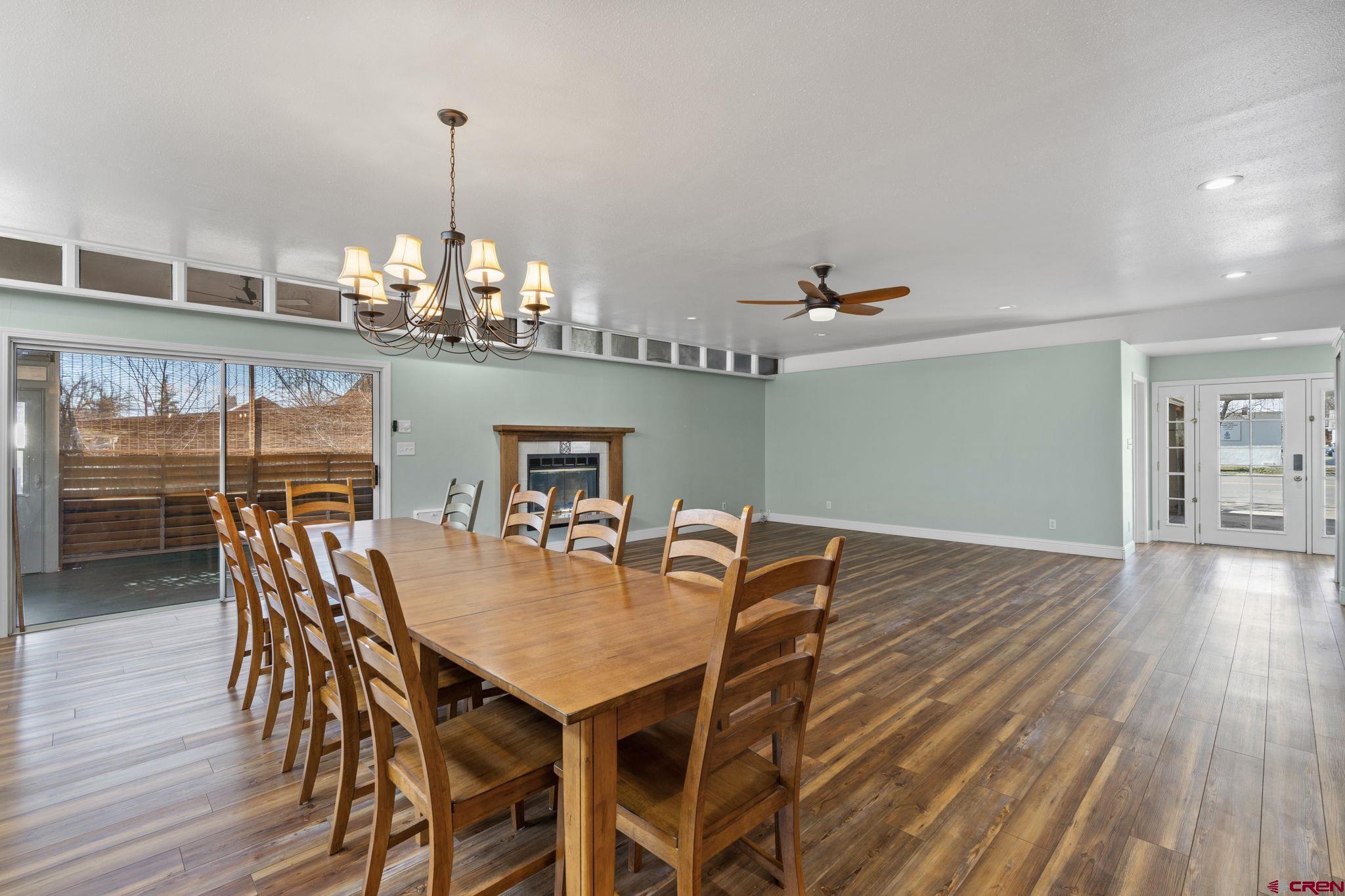 486 South Church Street Bayfield, CO 81122 - Photo 8 of 32 a view of a dining room with furniture wooden floor and chandelier