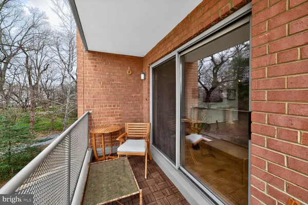 a balcony with view of a house