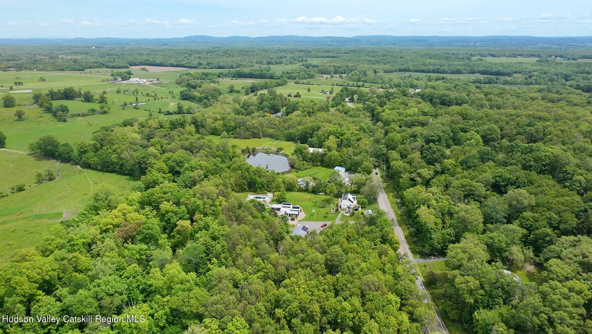 Tbd Tillson Lake Road Wallkill, NY 12589 - Photo 11 of 13 a view of a lush green forest with trees and some houses
