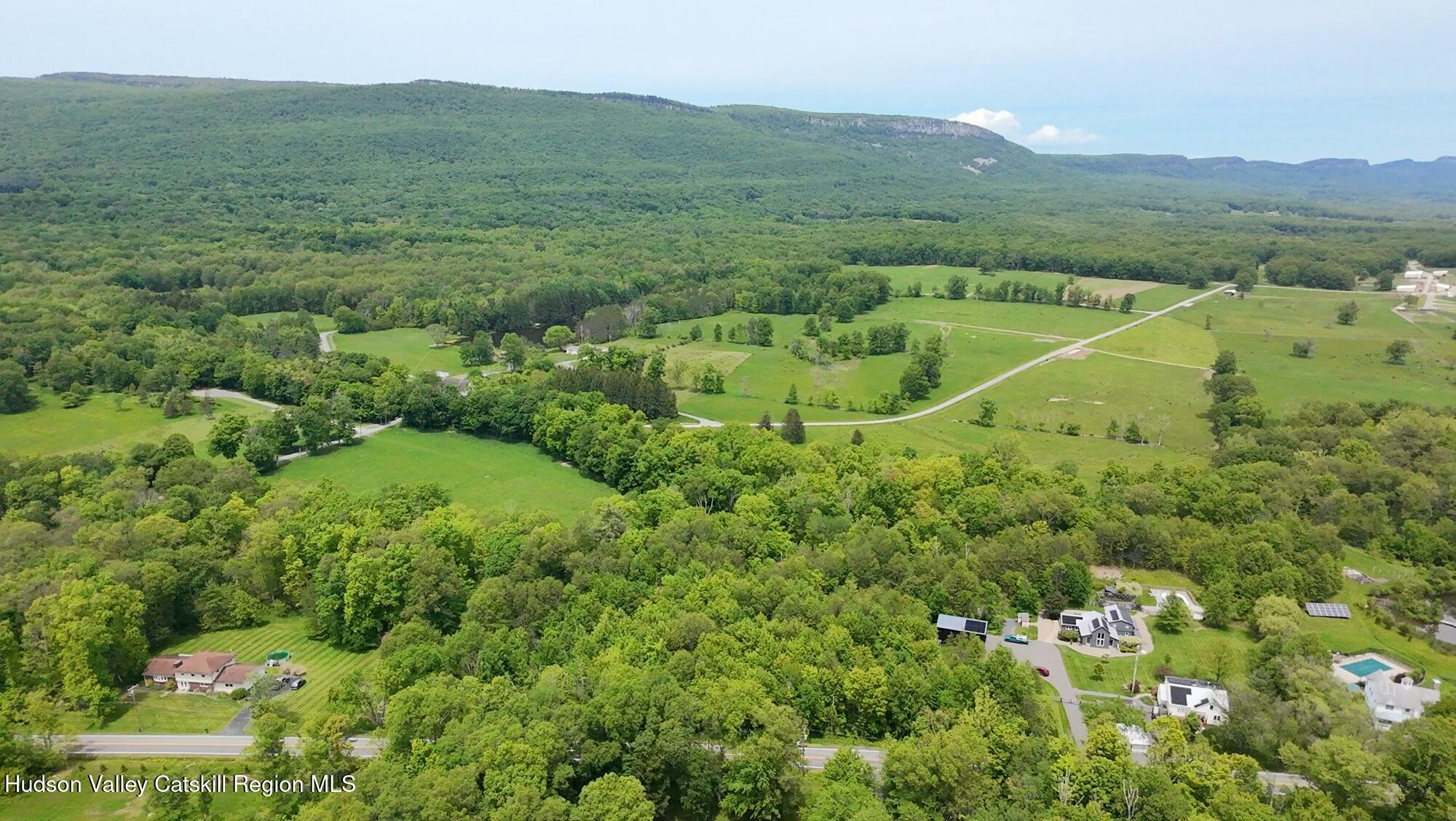 Tbd Tillson Lake Road Wallkill, NY 12589 - Photo 6 of 13 a view of a lush green forest with trees and some houses