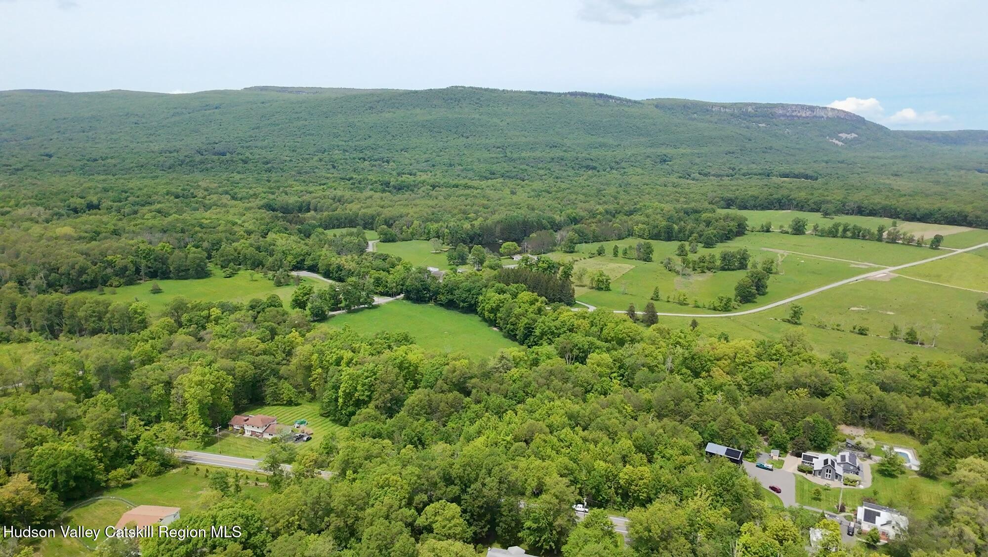 Tbd Tillson Lake Road Wallkill, NY 12589 - Photo 7 of 13 a view of a lush green hillside and houses