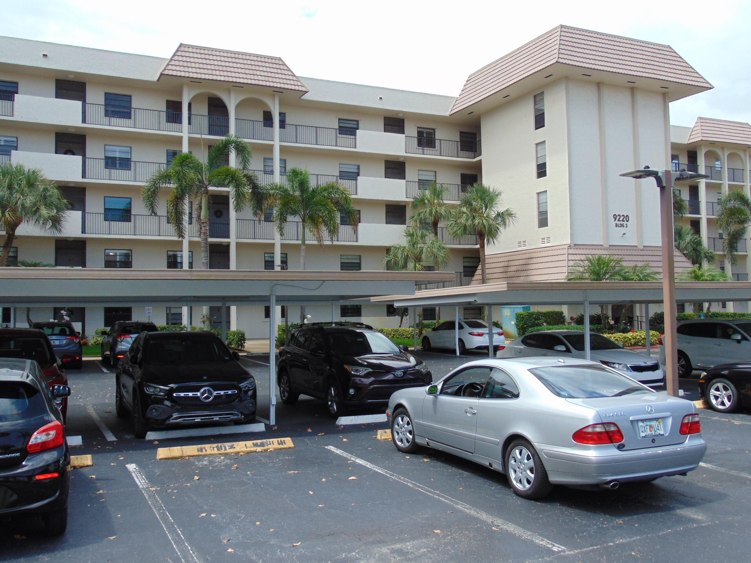 9220 Southwest 14th Street, Unit 3103 Boca Raton, FL 33428 - Photo 14 of 58 a car parked in front of a building