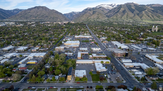 452 North 100 West, Unit 102 Logan, UT 84321 - Photo 31 of 34 Aerial view of property and surrounding area featuring a mountain backdrop