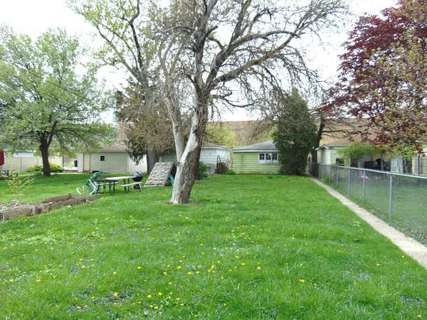 a view of a house with a back yard