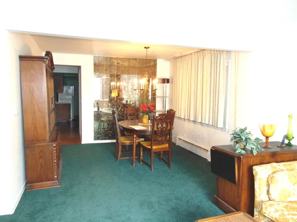 a dining room with furniture and window