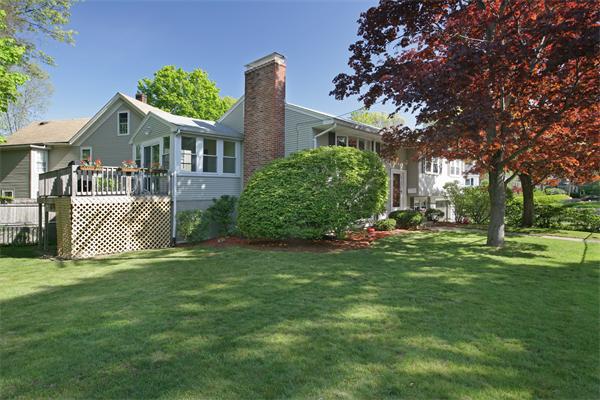 11 Marked Tree Road Needham, MA 02492 - Photo 2 of 9 a front view of a house with a garden