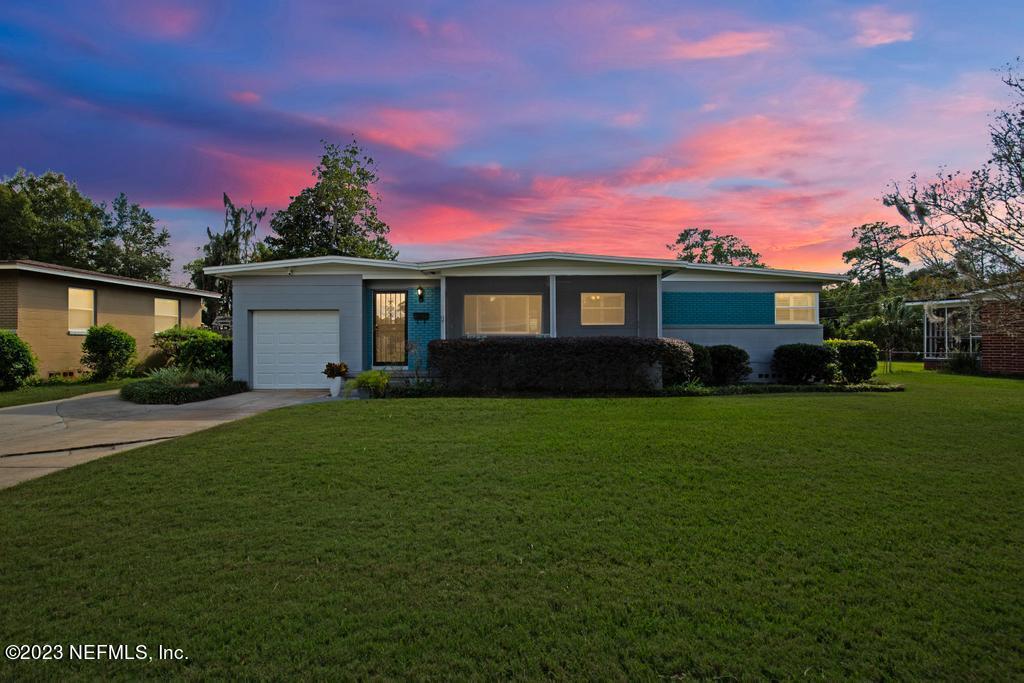 6712 E Road Jacksonville, FL 32216 - Photo 1 of 40 a front view of a house with a garden