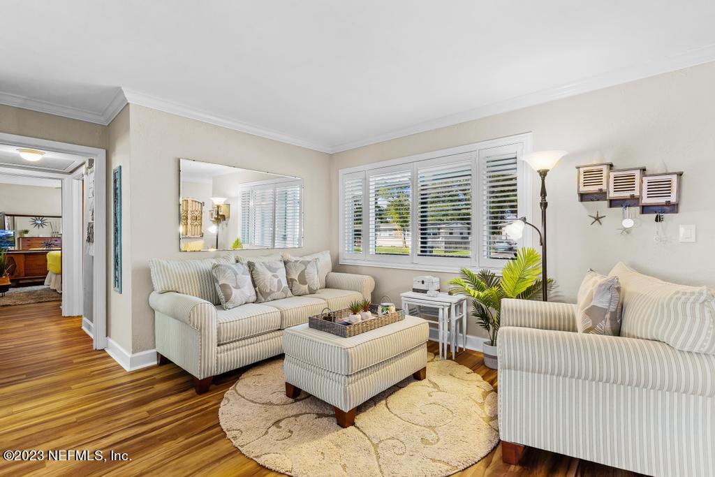 6712 E Road Jacksonville, FL 32216 - Photo 11 of 40 a living room with furniture and a wooden floor