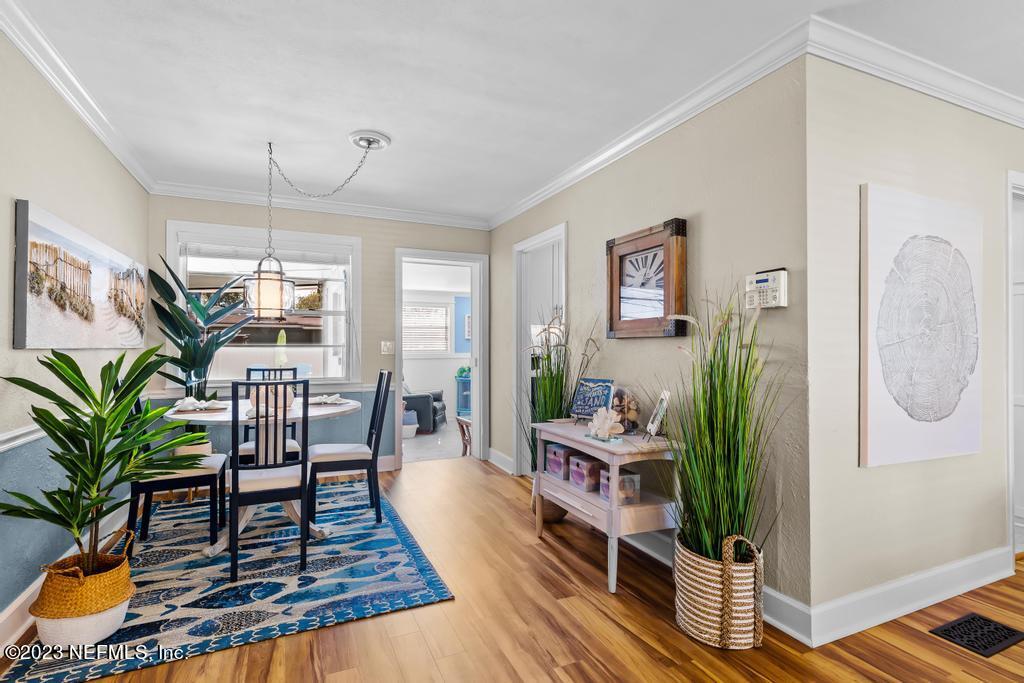 6712 E Road Jacksonville, FL 32216 - Photo 13 of 40 a living room with furniture wooden floor and a potted plant