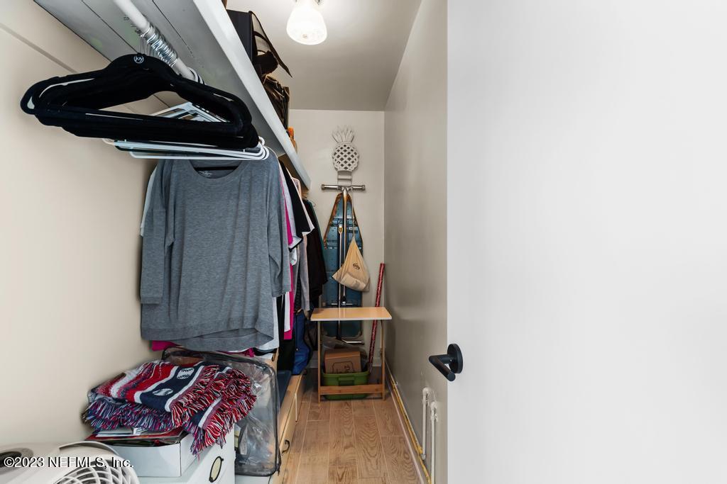 6712 E Road Jacksonville, FL 32216 - Photo 22 of 40 a view of walk in closet with clothes and shoes