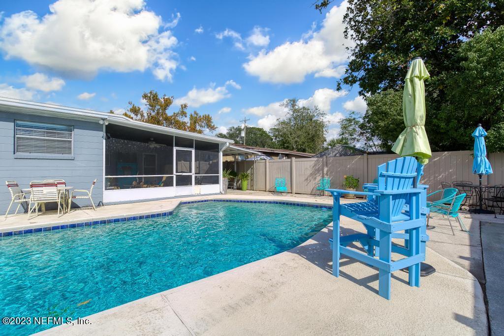 6712 E Road Jacksonville, FL 32216 - Photo 7 of 40 a view of a house with backyard sitting area and garden