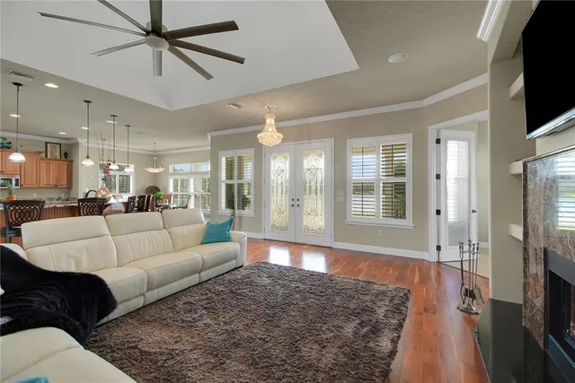 a view of a kitchen with a refrigerator a microwave and a sink