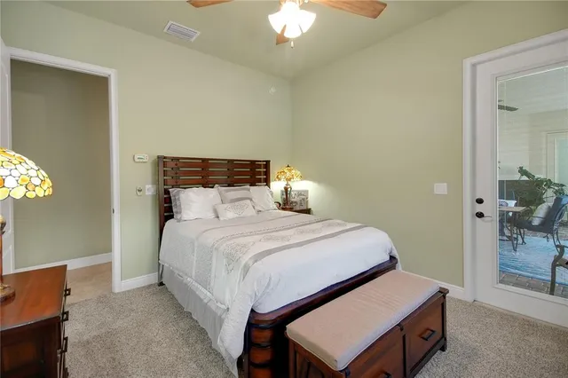 a view of a house with a swimming pool and yard