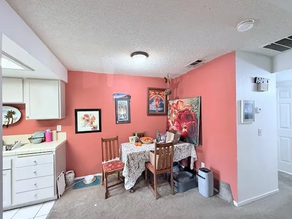 a bedroom with a workspace