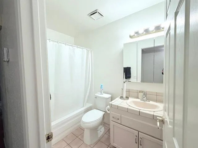 a view of a dining room with furniture window and chandelier