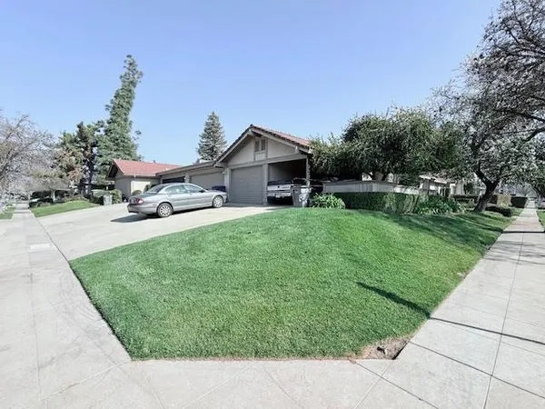 a view of a house with a yard porch and sitting area
