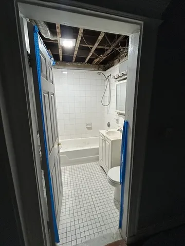 a kitchen with a stove and a refrigerator