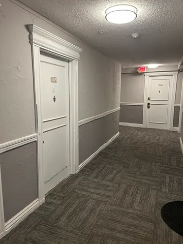 a kitchen with a stove a refrigerator and a sink