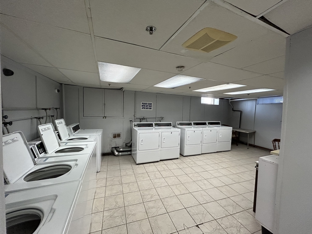 285 Lynn Shore Drive, Unit 308 Lynn, MA 01902 - Photo 9 of 11 a kitchen with a stove a refrigerator and a sink