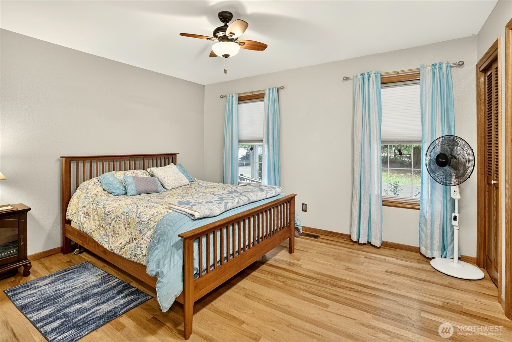 20070 Park Ridge Lane Sedro-Woolley, WA 98284 - Photo 14 of 40 a bedroom with a bed and wooden floor