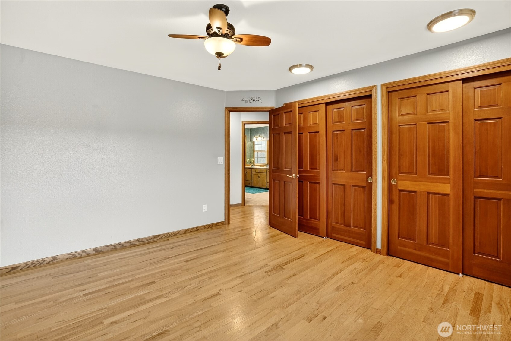20070 Park Ridge Lane Sedro-Woolley, WA 98284 - Photo 16 of 40 a view of an empty room with wooden floor and a window