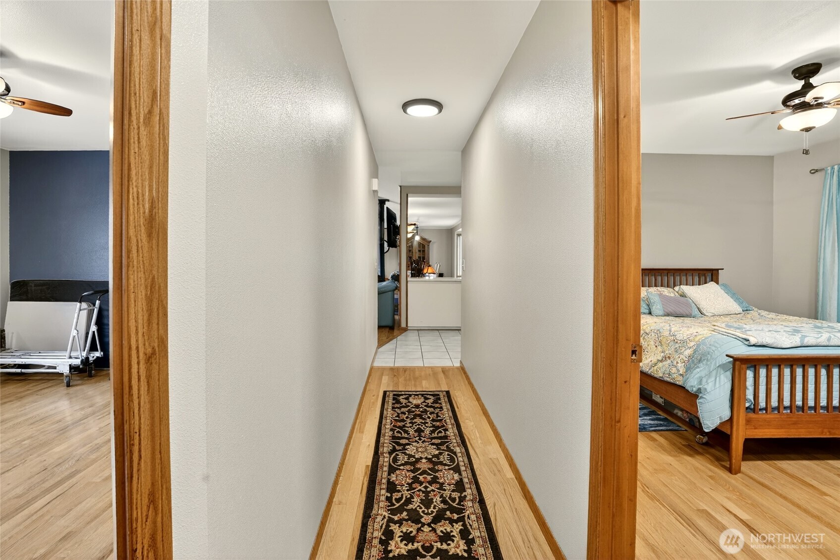 20070 Park Ridge Lane Sedro-Woolley, WA 98284 - Photo 17 of 40 a view of a hallway with wooden floor and a bathroom
