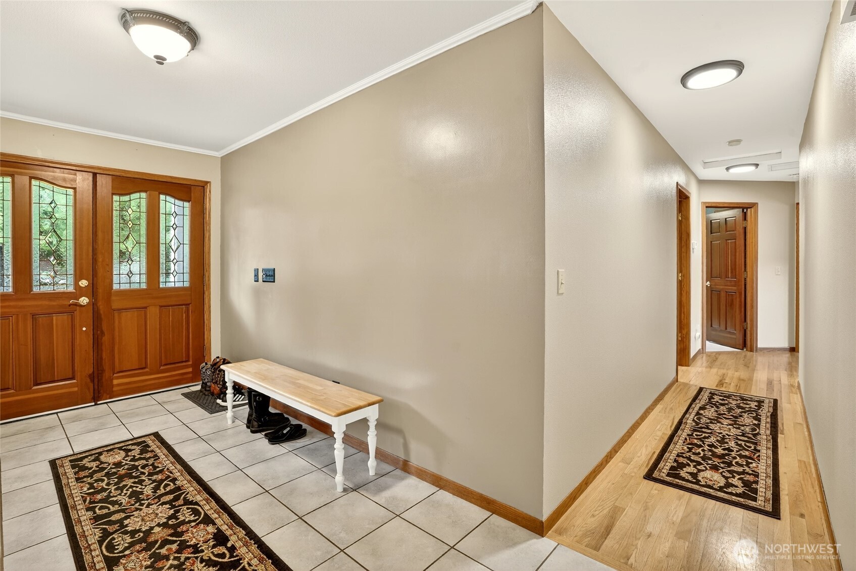20070 Park Ridge Lane Sedro-Woolley, WA 98284 - Photo 18 of 40 a view of a hallway with wooden floor and a bathroom