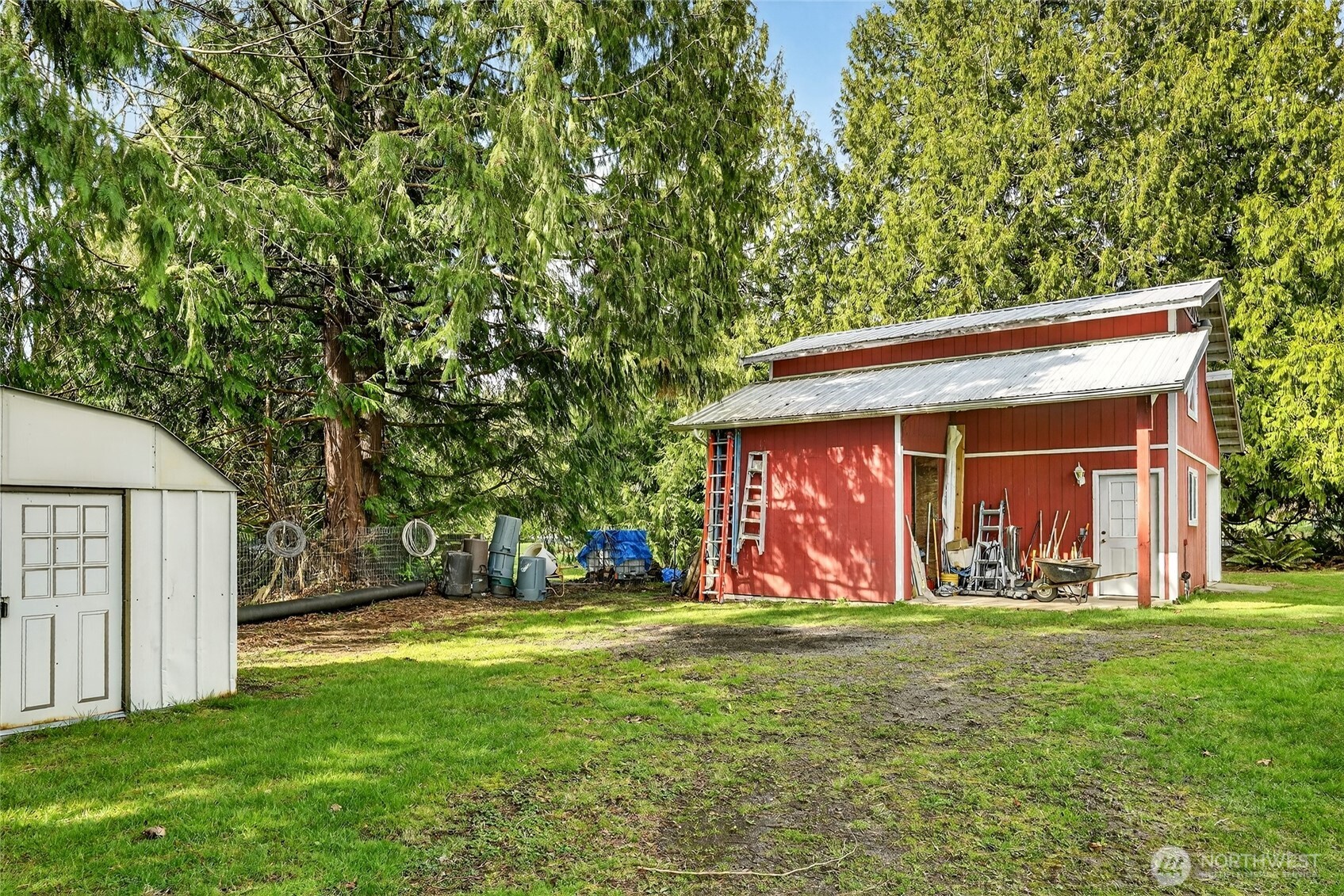 20070 Park Ridge Lane Sedro-Woolley, WA 98284 - Photo 28 of 40 a view of a backyard with table and chairs and a large tree
