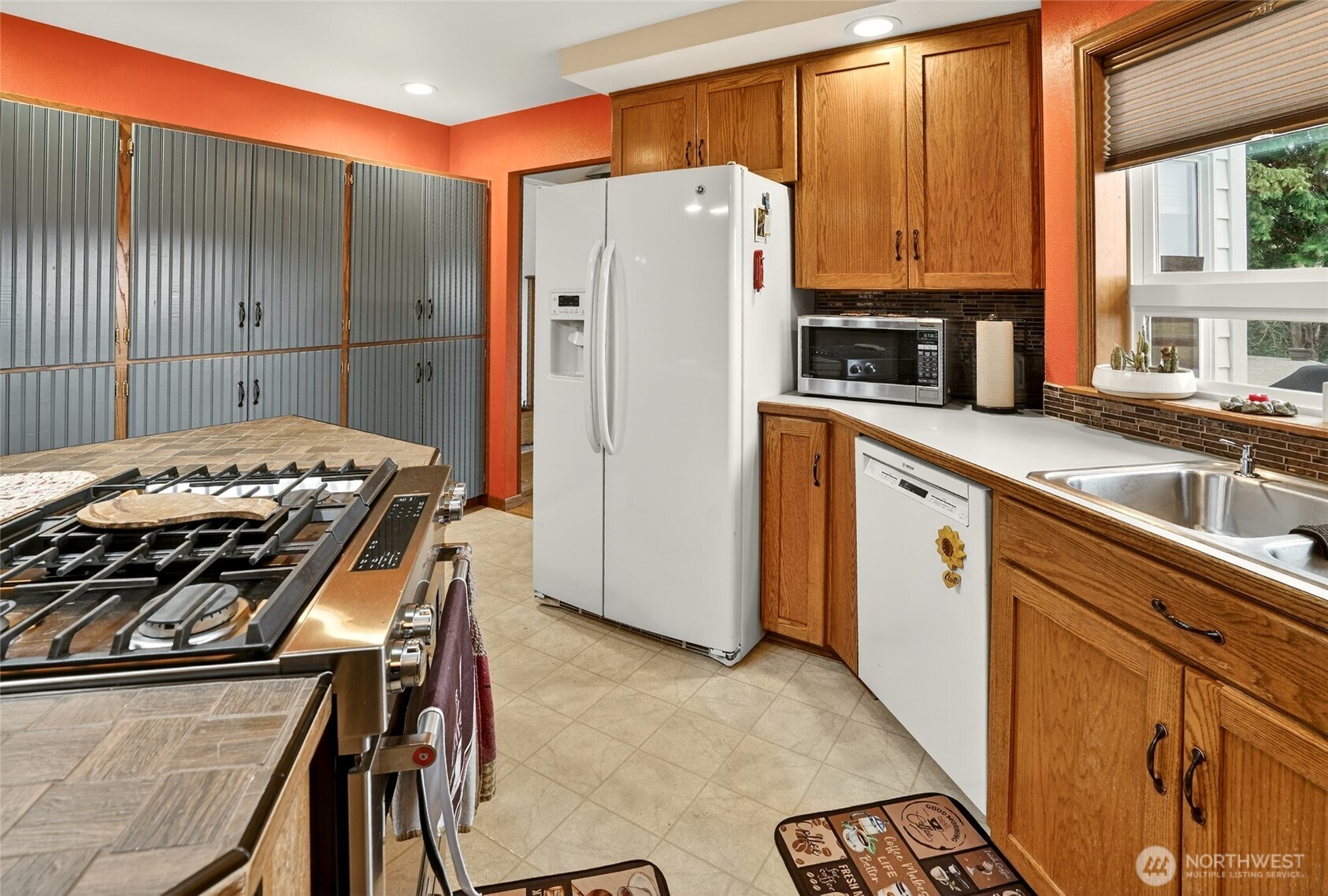 20070 Park Ridge Lane Sedro-Woolley, WA 98284 - Photo 8 of 40 a kitchen with stainless steel appliances granite countertop a refrigerator and a stove top oven