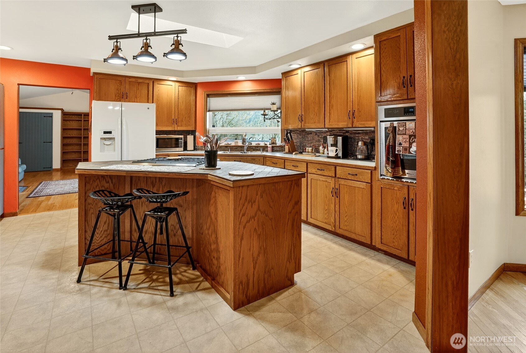 20070 Park Ridge Lane Sedro-Woolley, WA 98284 - Photo 9 of 40 a kitchen with stainless steel appliances a table and chairs in it