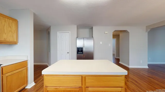 a room with a bed and cabinets