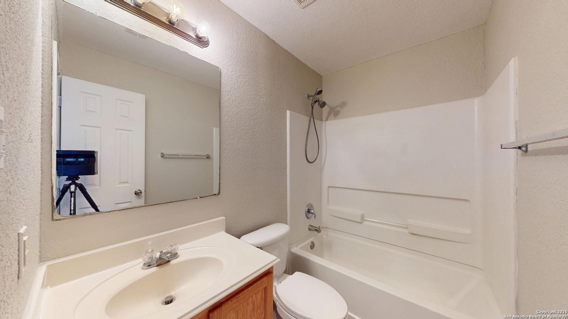 9515 Boatman Pier Converse, TX 78109 - Photo 22 of 41 a bathroom with a sink toilet and shower