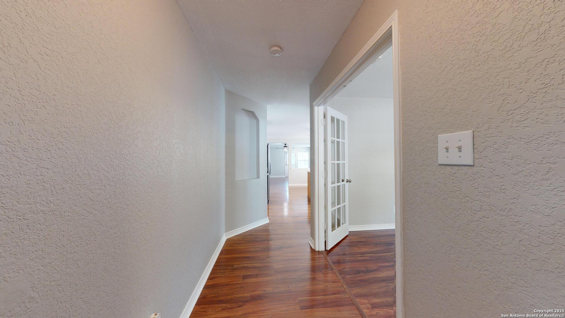 9515 Boatman Pier Converse, TX 78109 - Photo 3 of 41 a view of a hallway with wooden floor