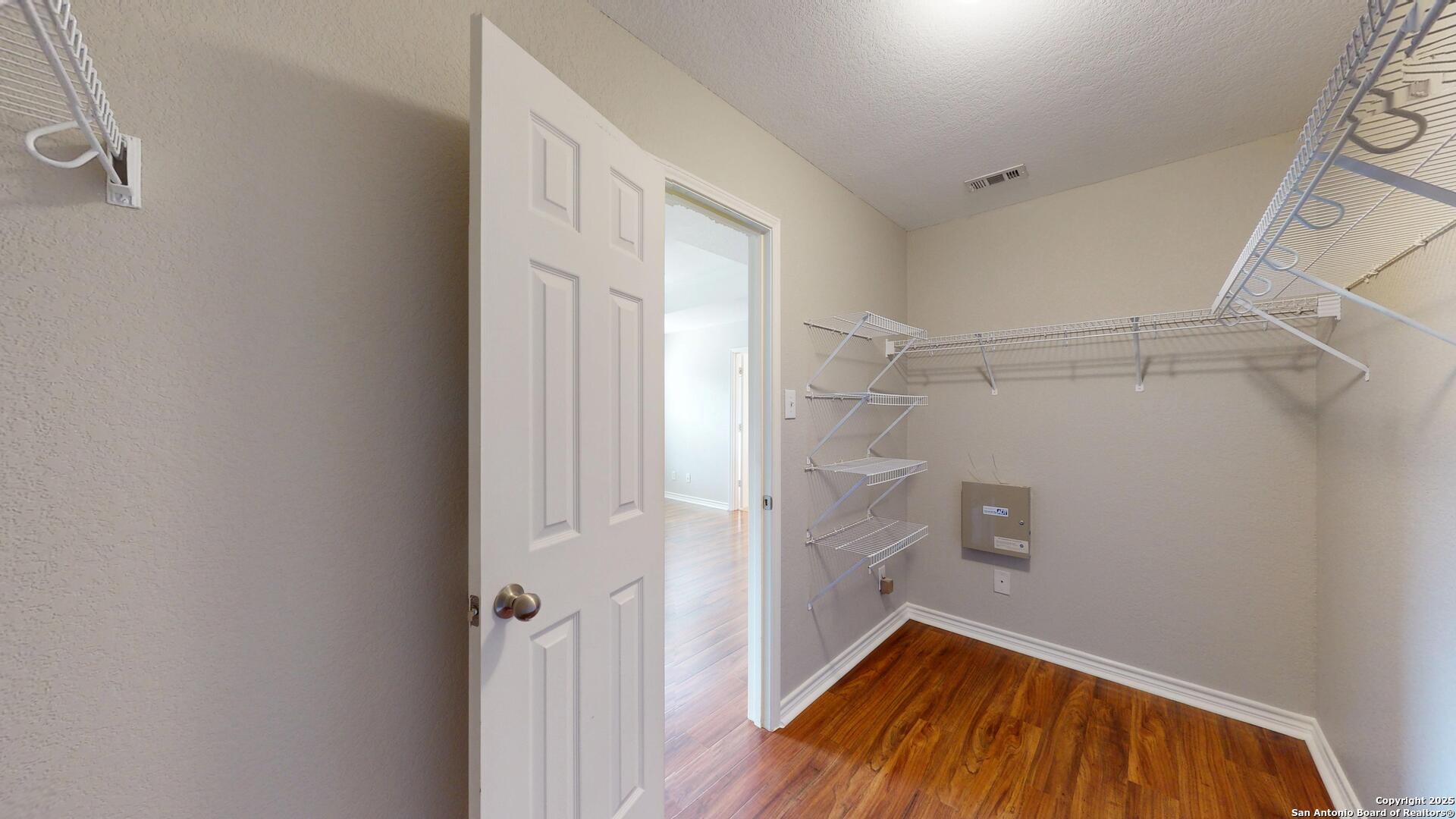 9515 Boatman Pier Converse, TX 78109 - Photo 32 of 41 a view of walk in closet with empty racks