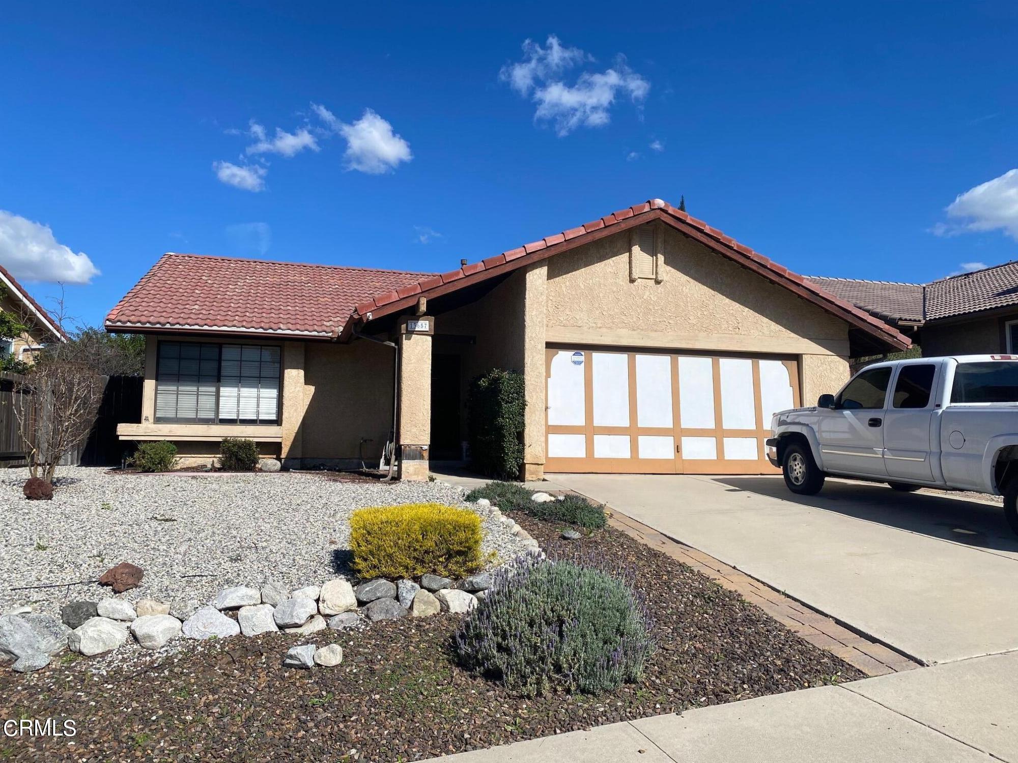 13657 Gunsmoke Road Moorpark, CA 93021 - Photo 26 of 26 a front view of a house with a yard