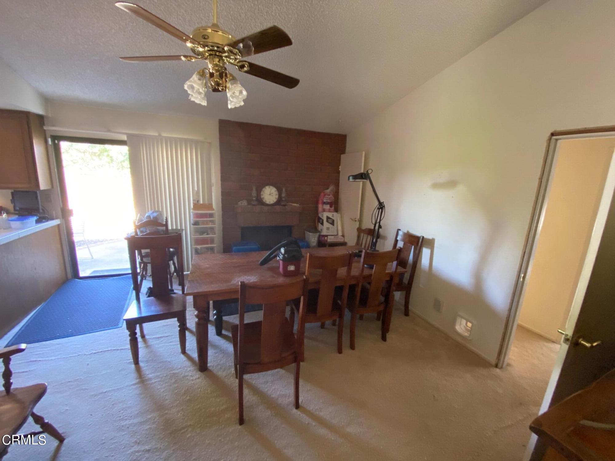 13657 Gunsmoke Road Moorpark, CA 93021 - Photo 3 of 26 a view of a dining room with furniture and chandelier