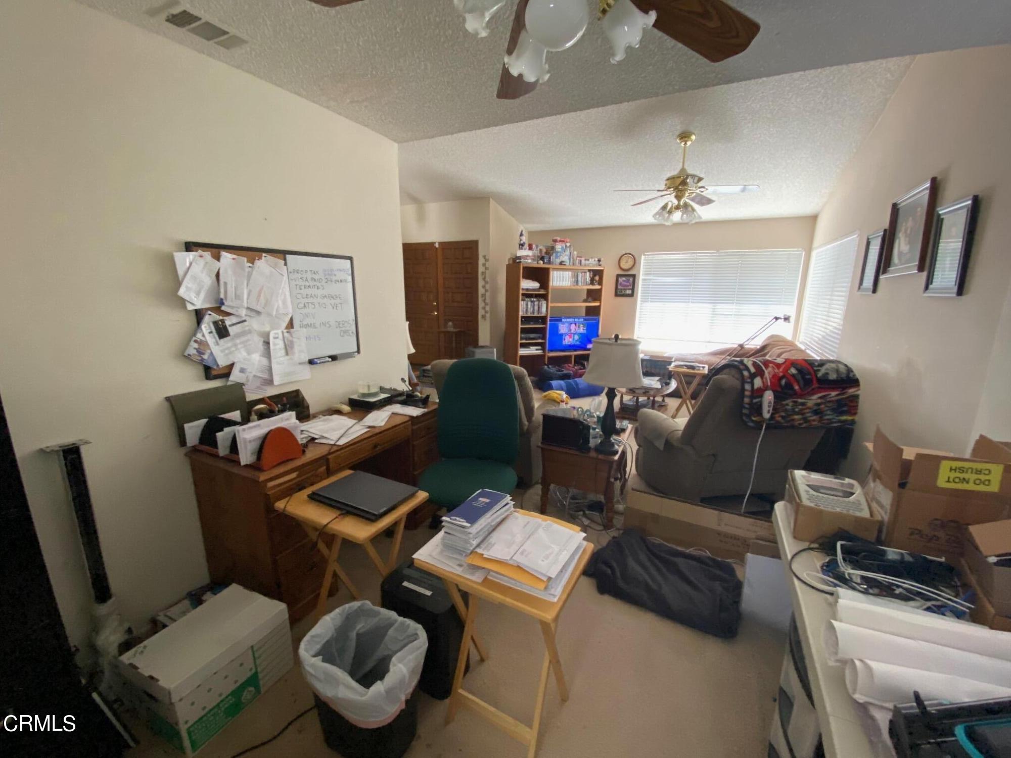 13657 Gunsmoke Road Moorpark, CA 93021 - Photo 7 of 26 a work room with furniture and wooden floor
