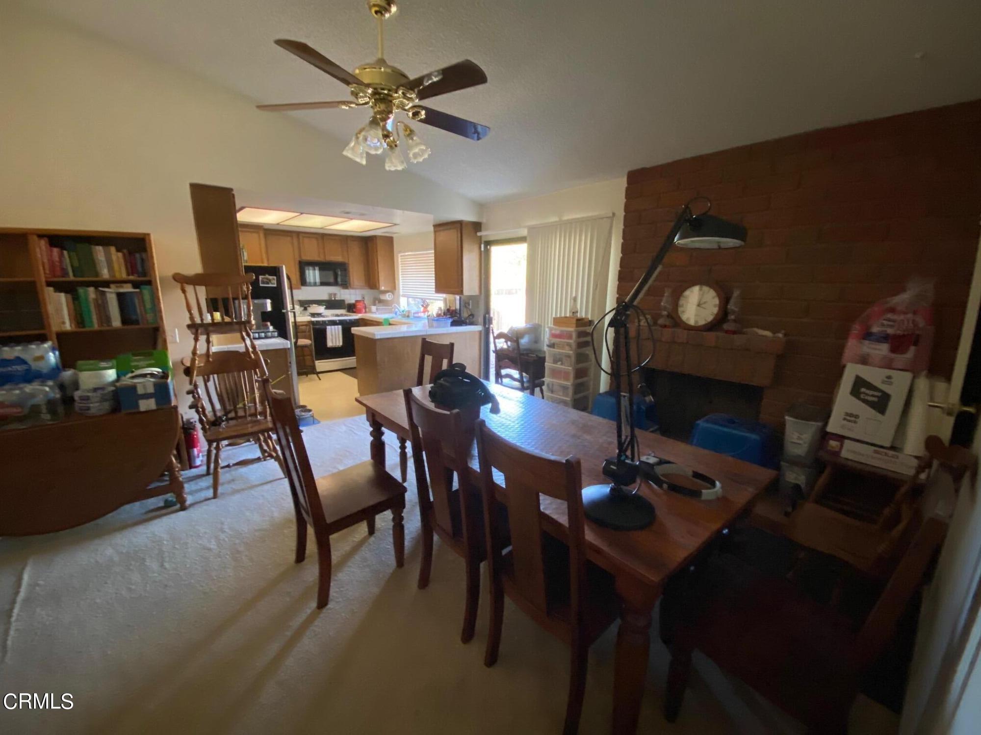 13657 Gunsmoke Road Moorpark, CA 93021 - Photo 9 of 26 a view of a dining room with furniture and a chandelier