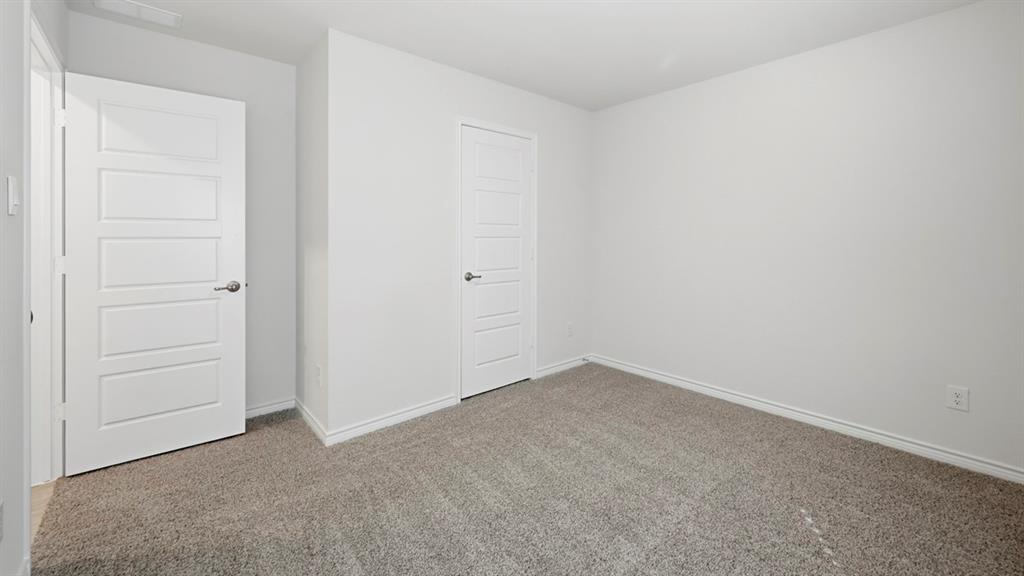 3513 Amaretto Road Aubrey, TX 76227 - Photo 18 of 34 an empty room with closet