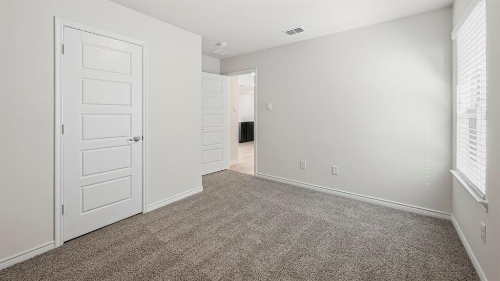 3513 Amaretto Road Aubrey, TX 76227 - Photo 21 of 34 an empty room with windows