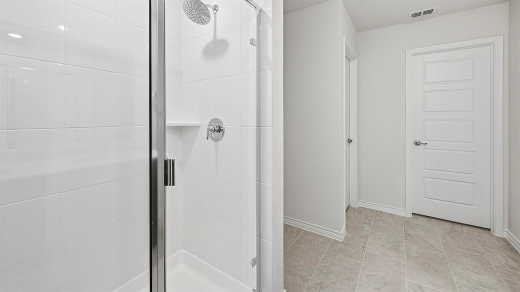 3513 Amaretto Road Aubrey, TX 76227 - Photo 3 of 34 a bathroom with a shower