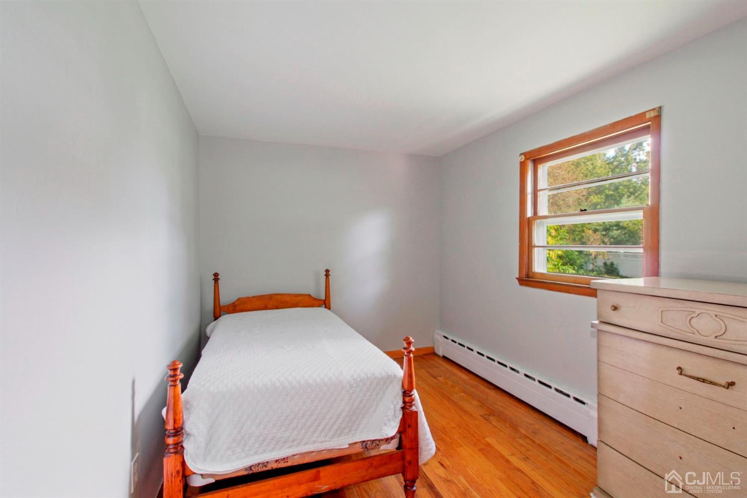 159 Vineyard Road Edison, NJ 08817 - Photo 9 of 30 a room with a bed and a window