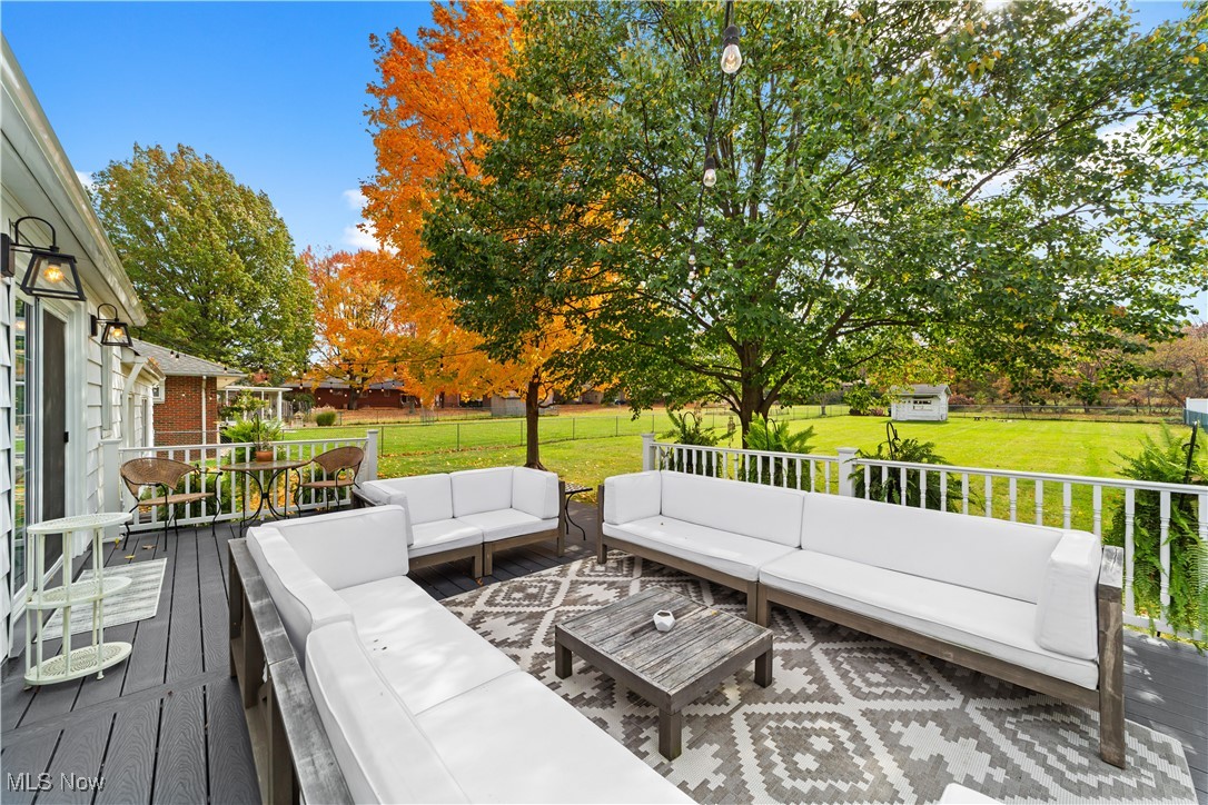 4648 Ammon Road Cleveland, OH 44143 - Photo 40 of 48 Composite deck with an outdoor living space, a lawn, and a storage shed