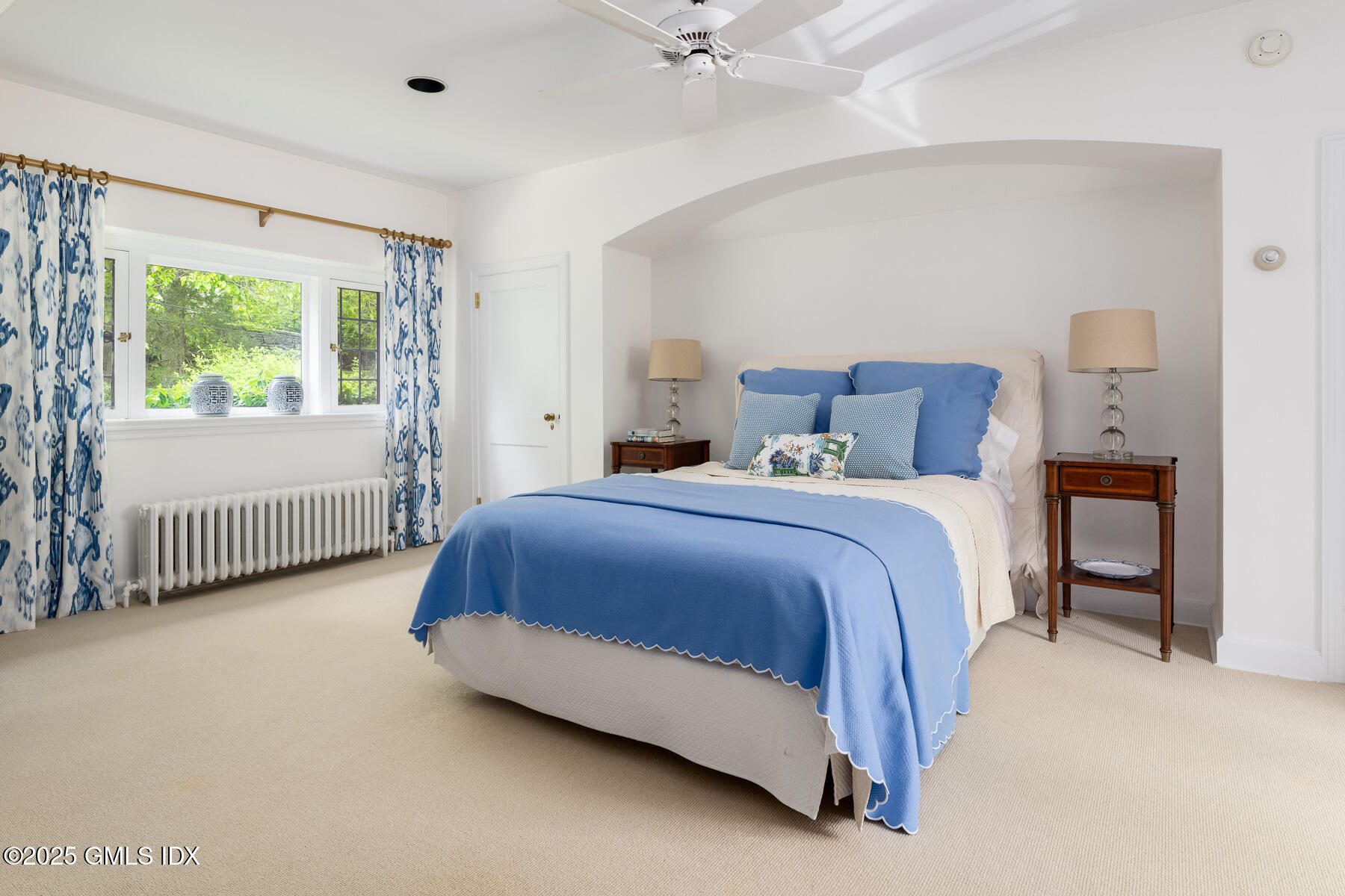 78 Khakum Wood Road Greenwich, CT 06831 - Photo 15 of 27 a spacious bedroom with a bed and a large window