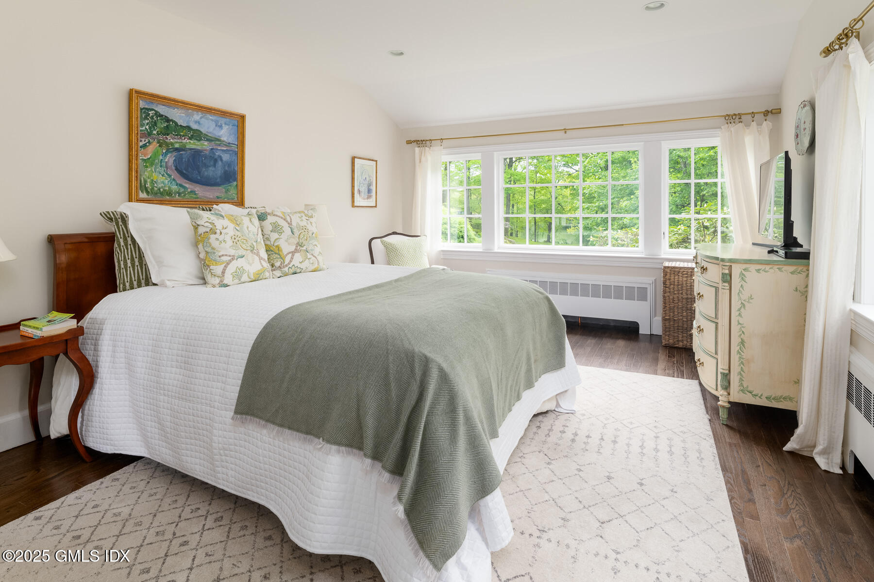 78 Khakum Wood Road Greenwich, CT 06831 - Photo 16 of 27 a spacious bedroom with a bed and a window