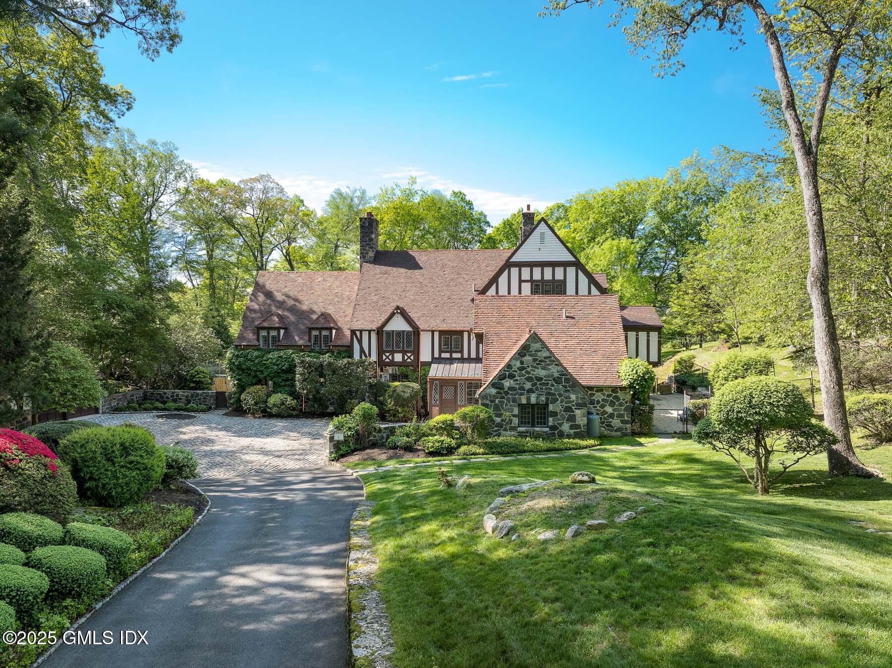 78 Khakum Wood Road Greenwich, CT 06831 - Photo 23 of 27 a view of a house with a big yard