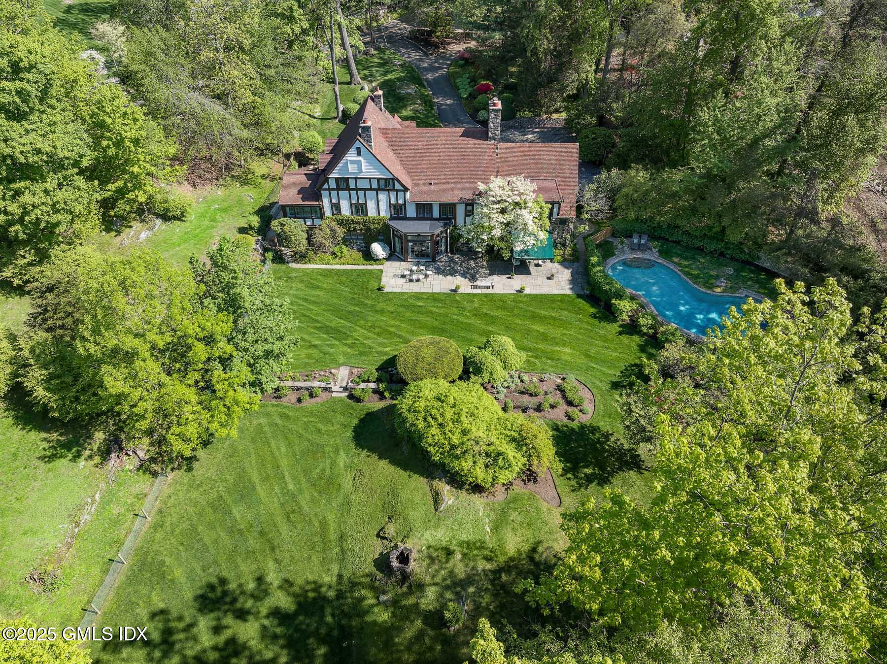 78 Khakum Wood Road Greenwich, CT 06831 - Photo 24 of 27 a aerial view of a house with a yard and large tree
