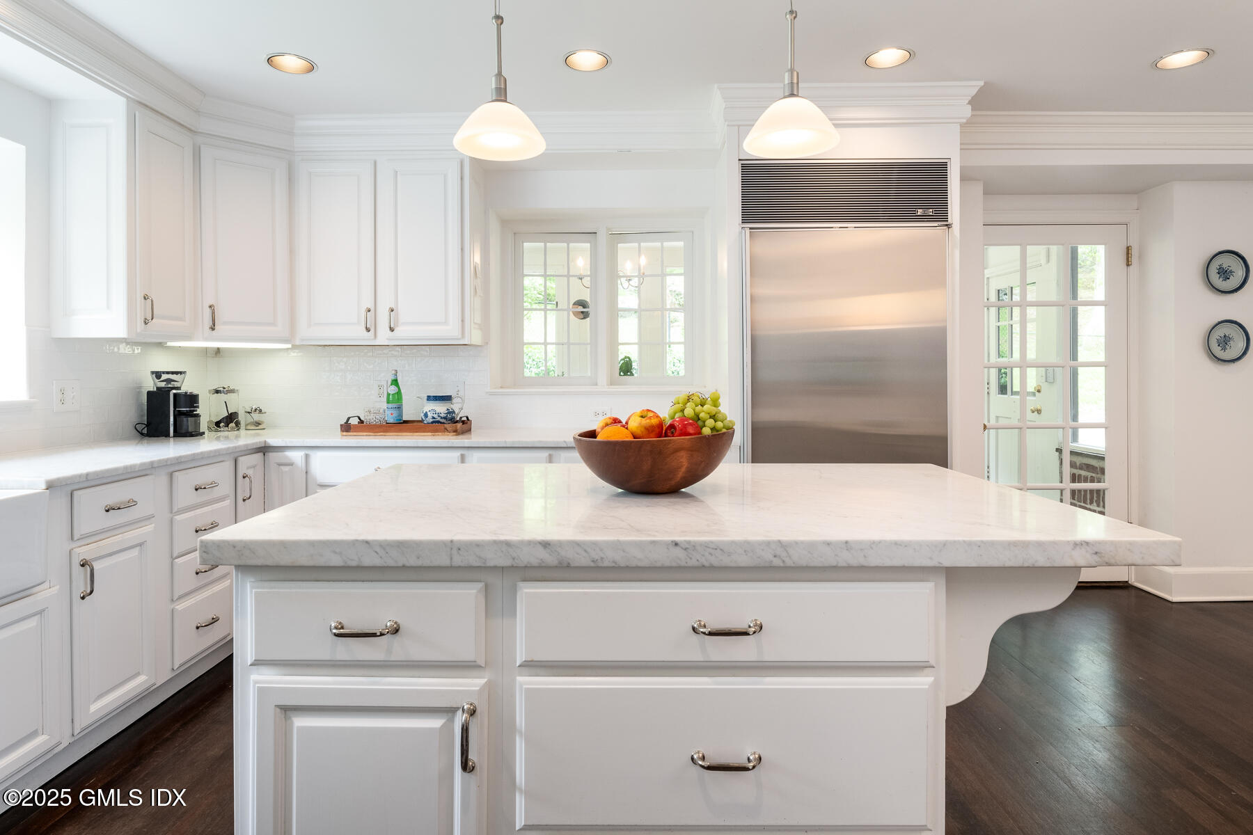78 Khakum Wood Road Greenwich, CT 06831 - Photo 9 of 27 a kitchen with stainless steel appliances granite countertop a sink a stove and white cabinets