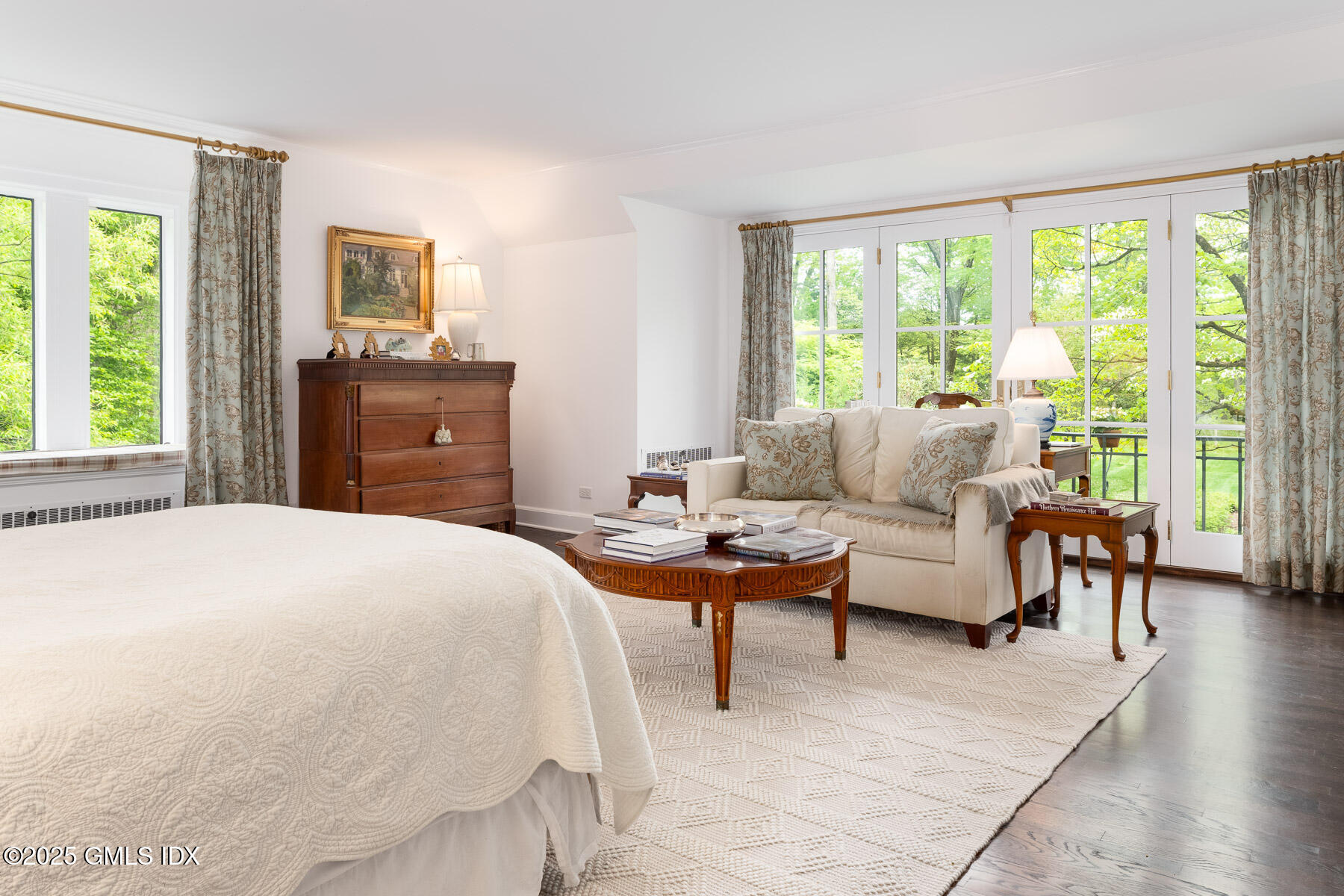 78 Khakum Wood Road Greenwich, CT 06831 - Photo 10 of 27 a bedroom with a bed and large windows